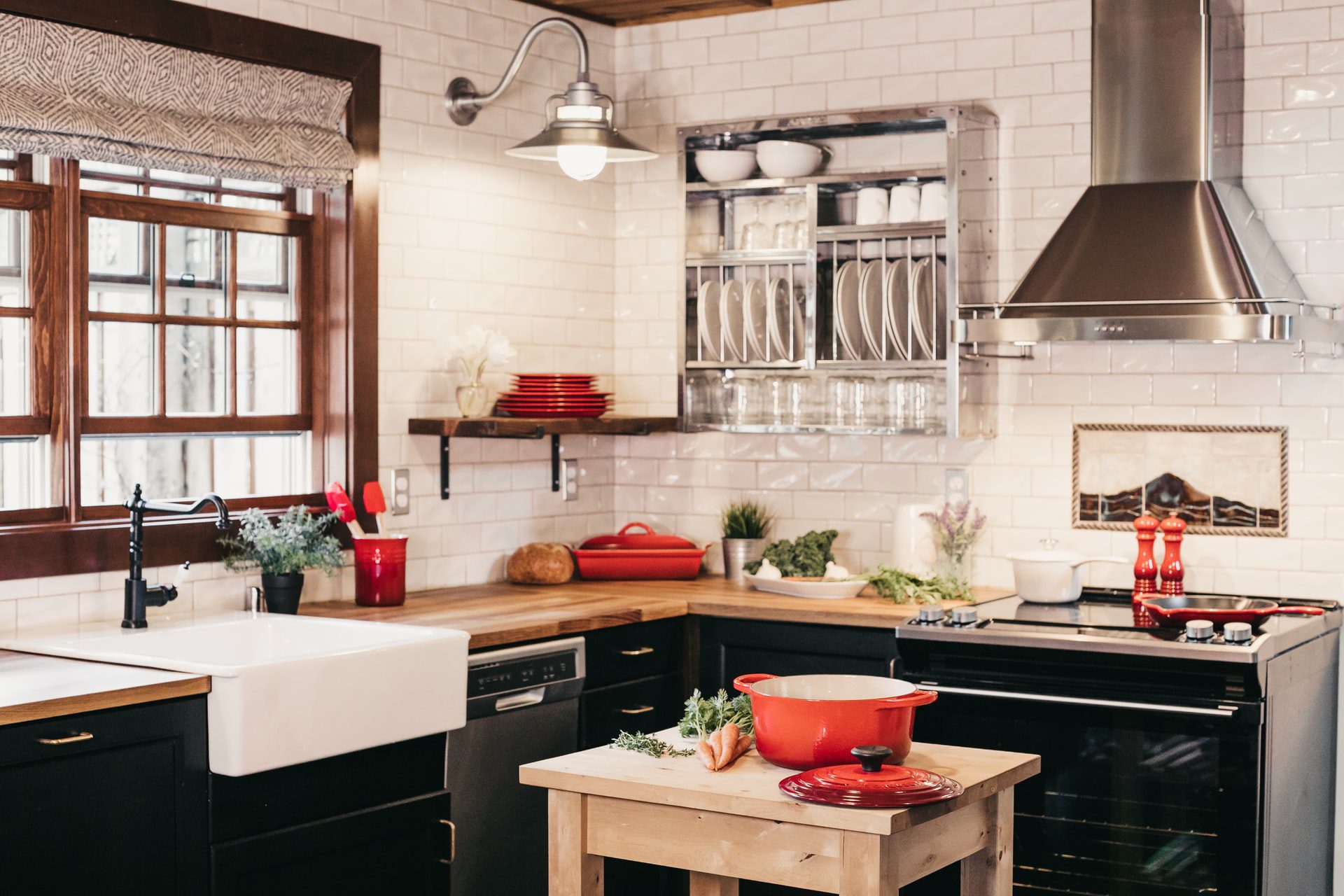 A Kitchen With Red Cooking Ware