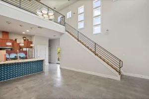Custom mezzanine balcony and staircase included in this home renovation.
