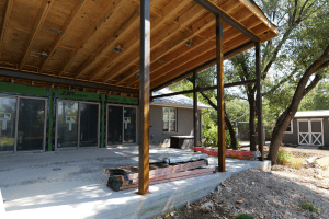 Cedar Park Freccia Group project progress picture of patio renovation. Wooden beams and patio roof.