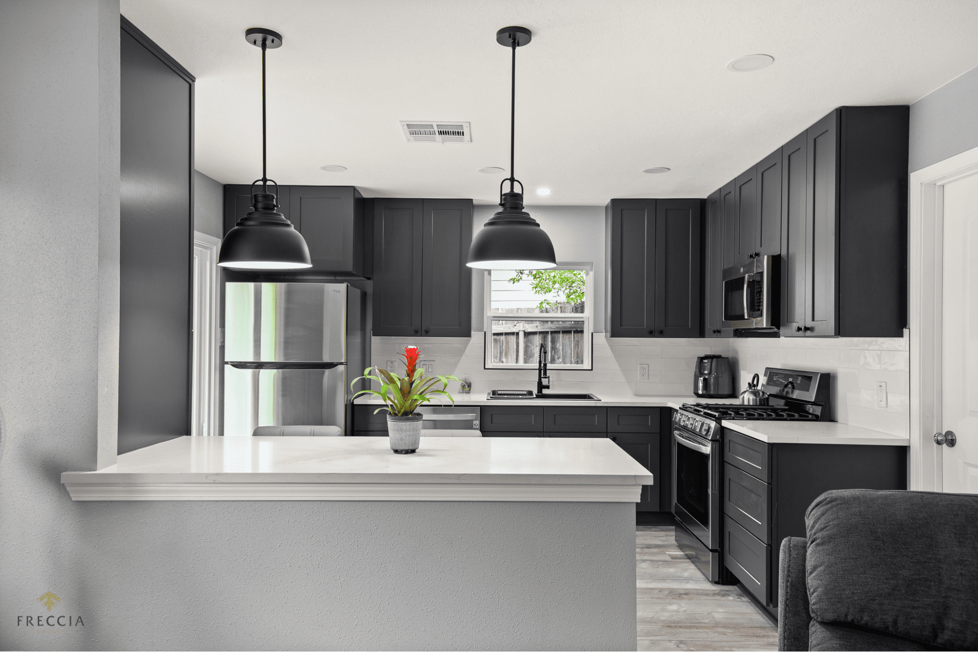 Newly renovated kitchen in Austin, TX! Beautiful quartz countertops, light fixtures, and more!
