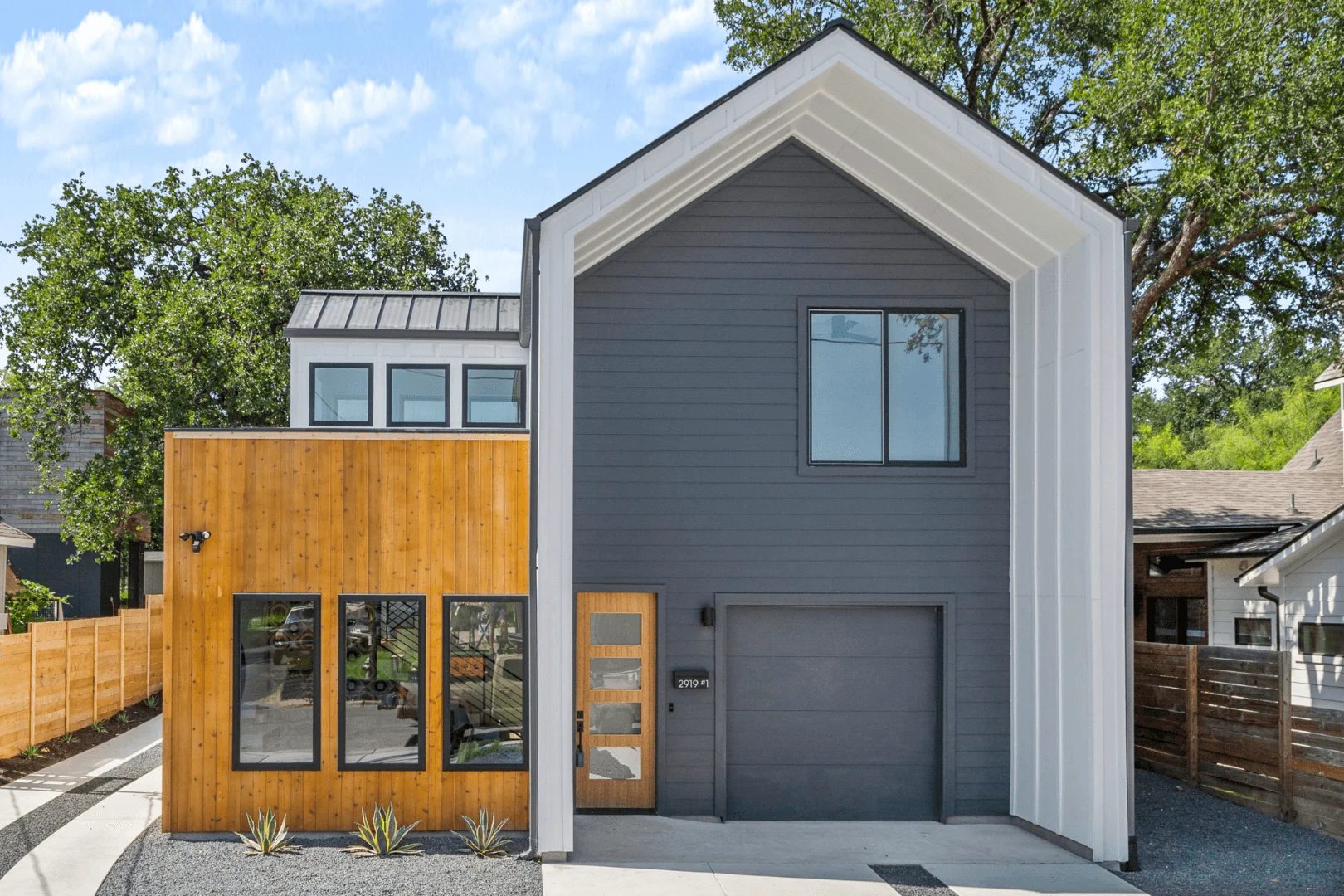 Side view of a custom built home in Austin, TX by Freccia Group. We use only the highest quality construction materials.