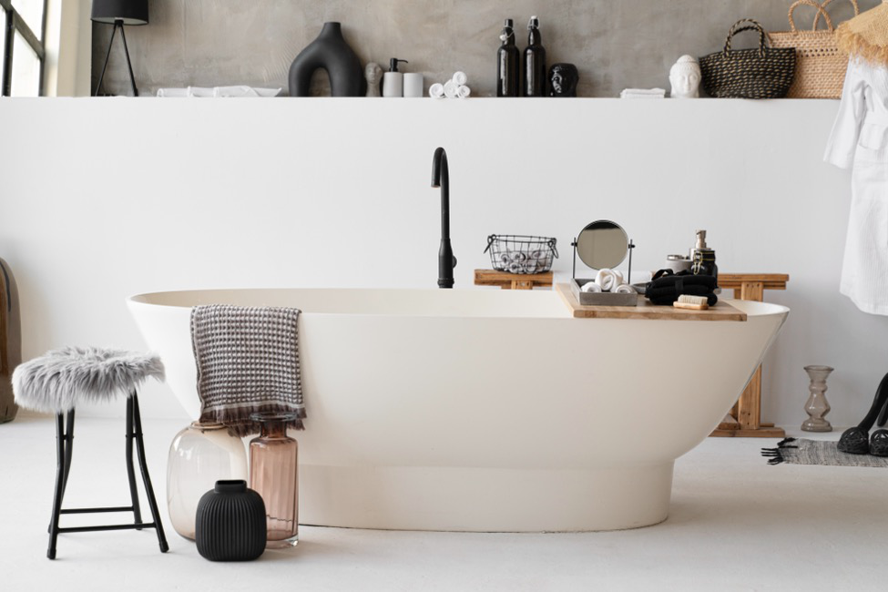 A modern bathroom makeover with a spa tub and wood accent pieces.