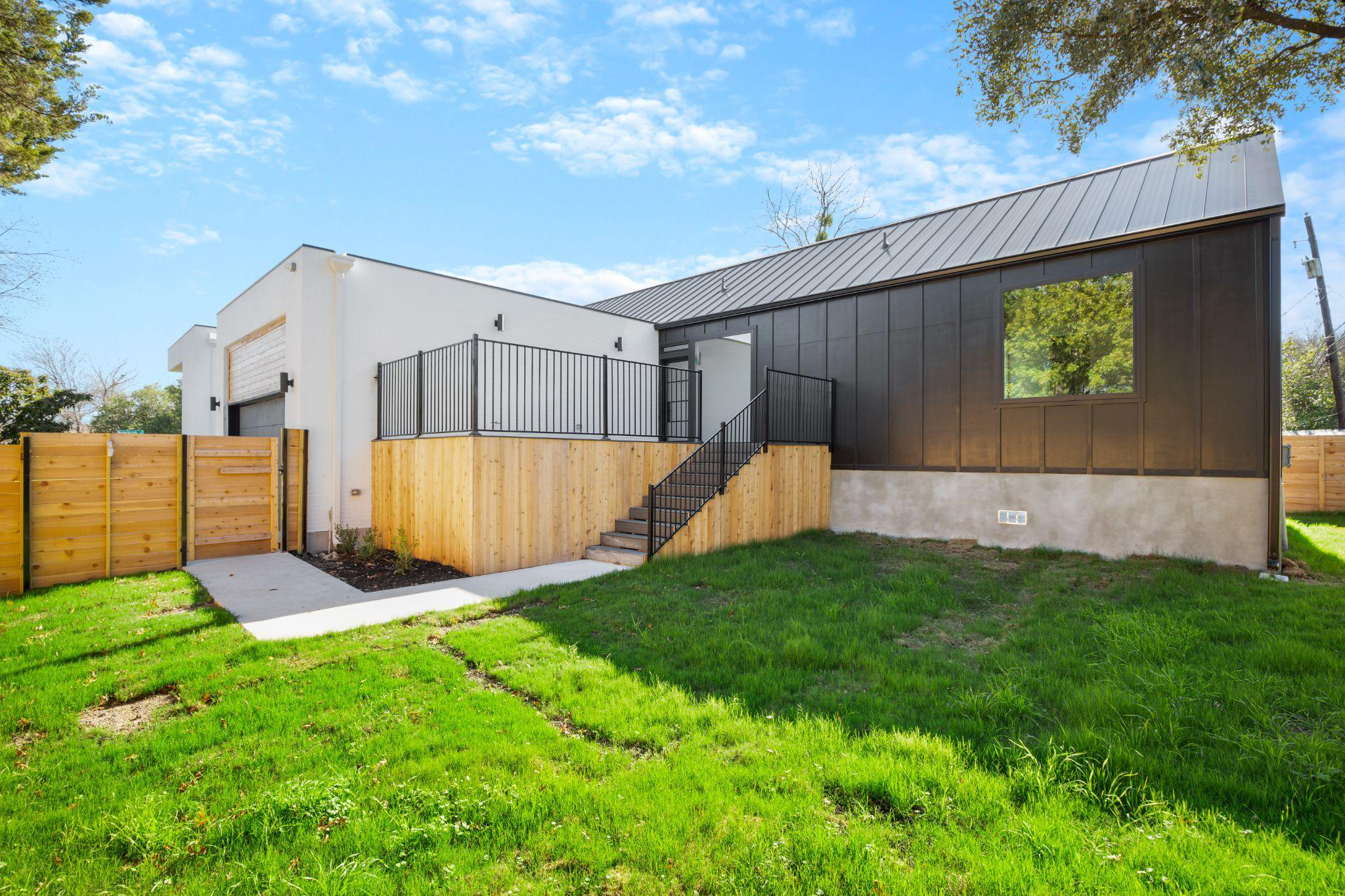 A new sustainable house situated on a lot with grass in Austin.