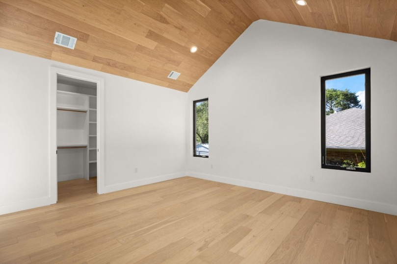 Windows and closet space inside a room addition for enhanced lifestyle.