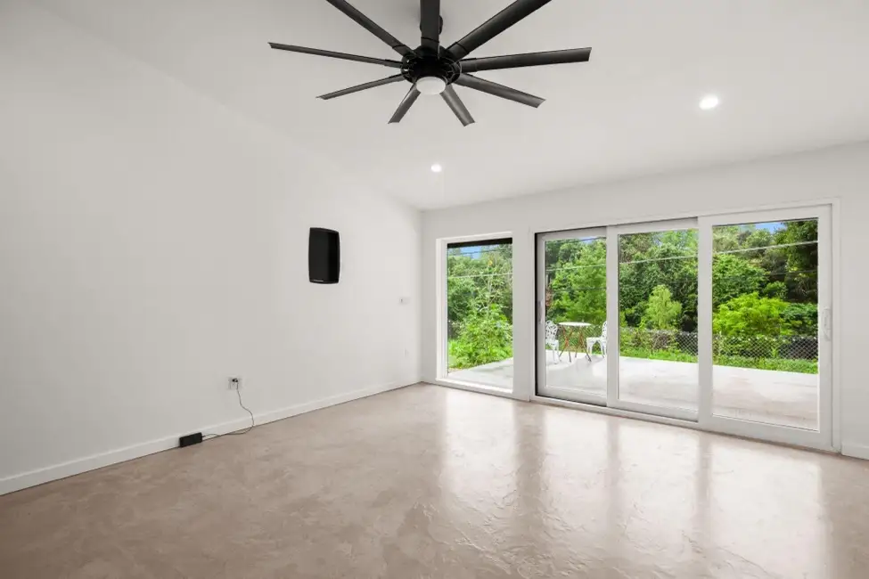 Windows and a fan inside a room addition for enhanced lifestyle.