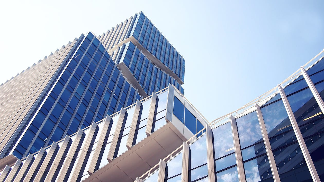 A glass building with sky in the background