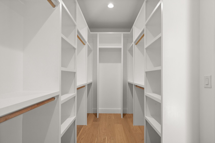 A closet with a shelf system expanded into attic space.