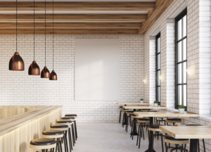 A renovated restaurant showcasing wood tables and chairs. 